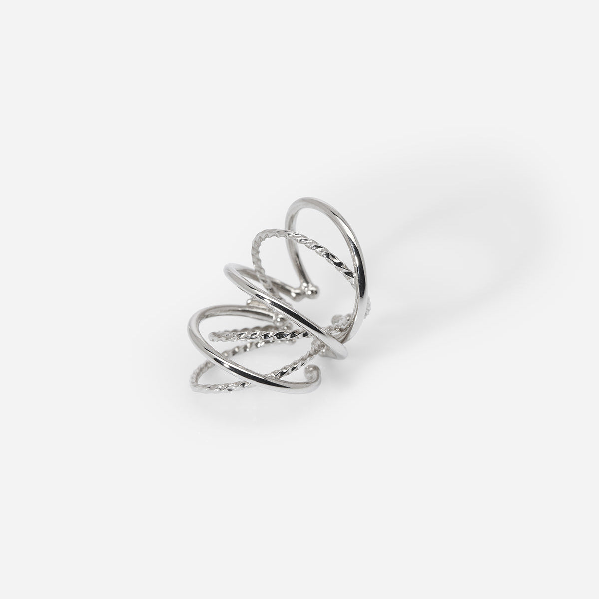 Bijou d’oreille unisexe Saturne en métal argenté, pour oreille non percée, à la structure multi-anneaux.
